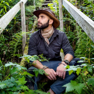 Coyote Peterson-Sits-on-Stairs in Jungle